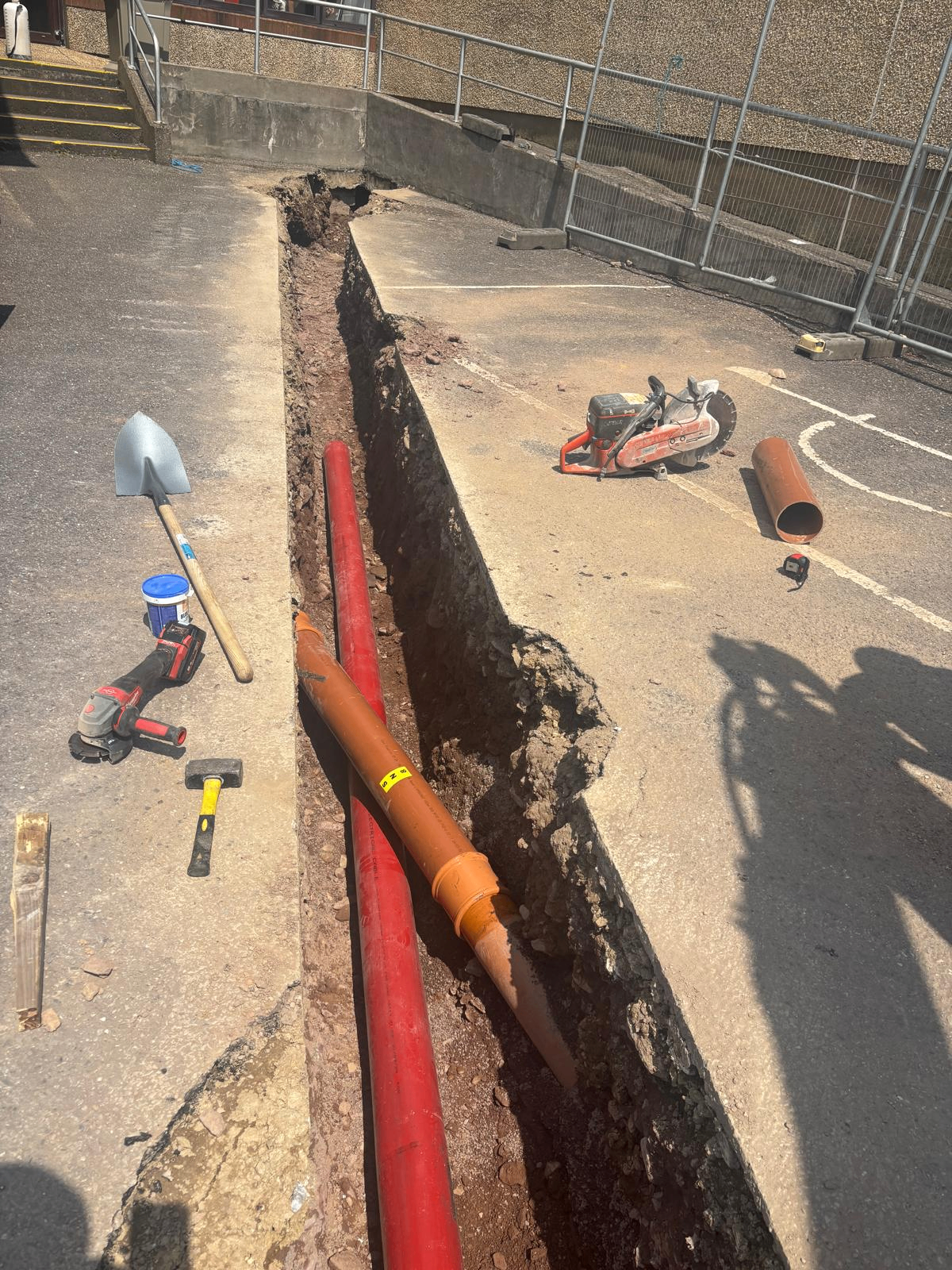 Drainage trench with orange pipework laid in Cork